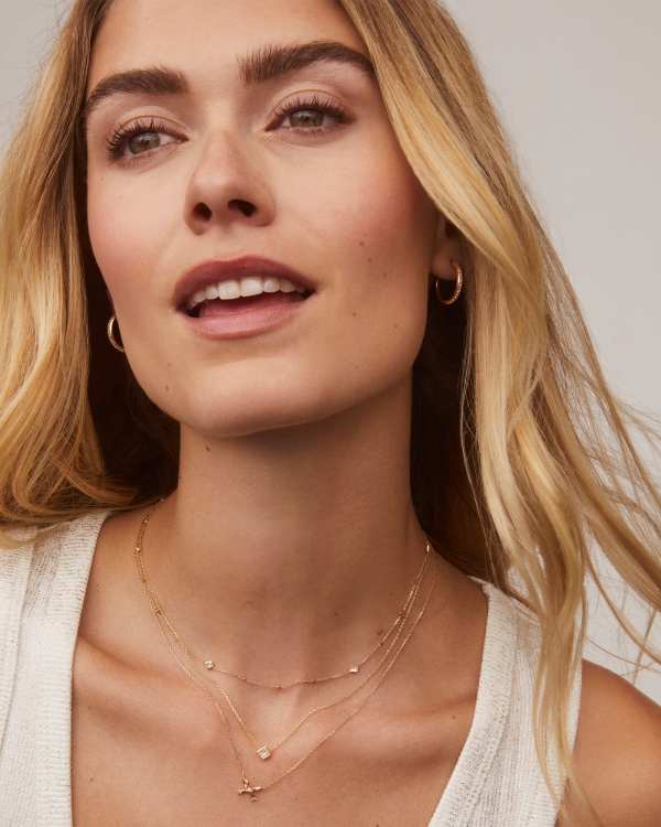 Tiny Bow 14k Yellow Gold Pendant Necklace in White Diamond - alternate view